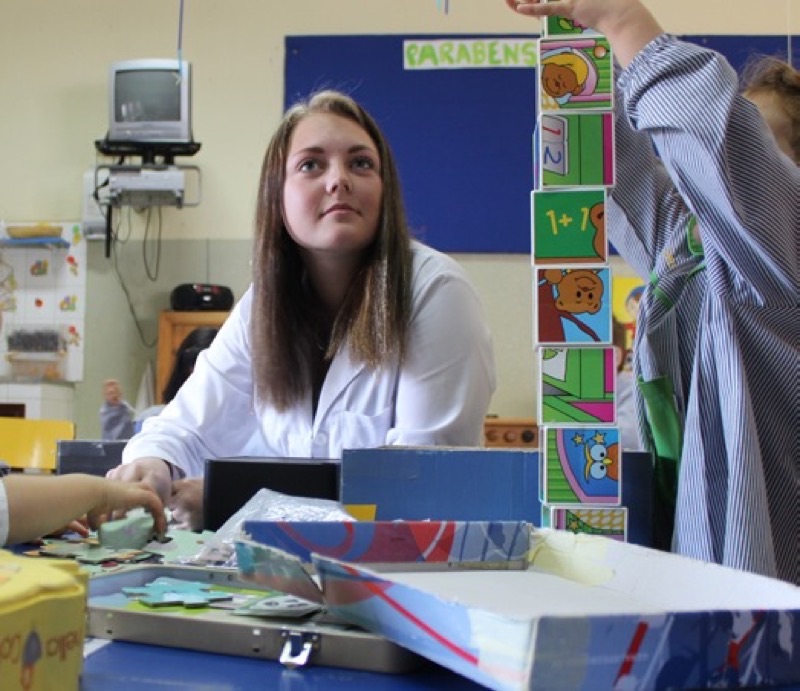 Childcare trainee in a nursery classroom
