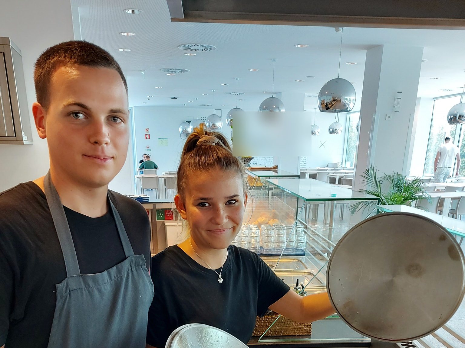Kitchen trainees cooking in a professional kitchen