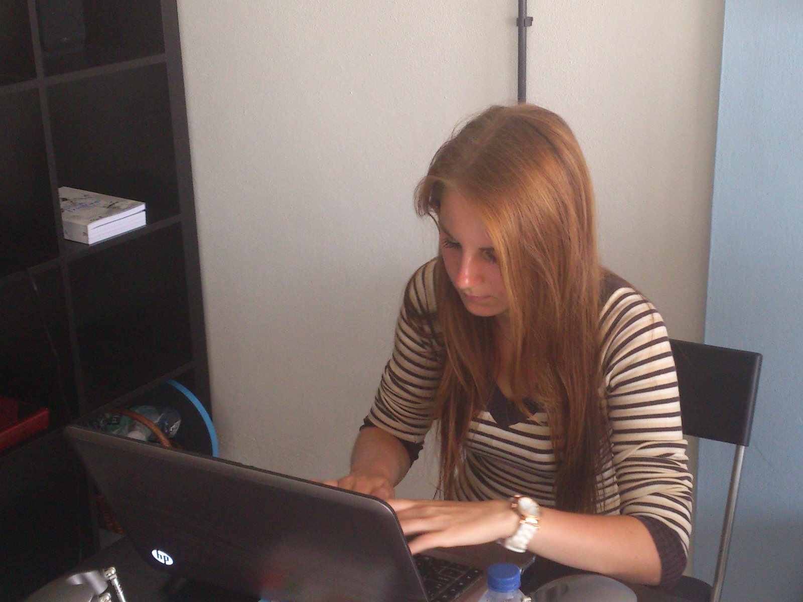Trainee working on a laptop during an administration internship in Braga